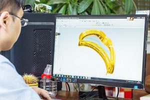 An engineer working on a 3D model of Fetop goggles