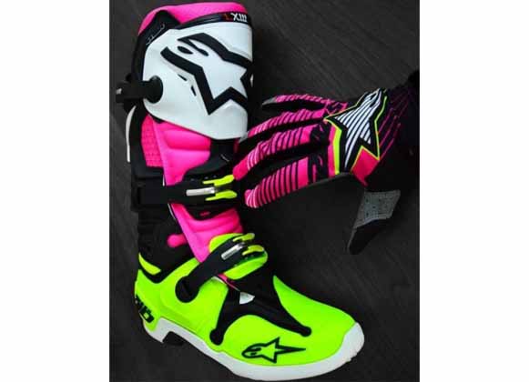 A multicolored motocross boot and glove