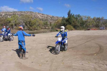 A motocross training session in an open lot