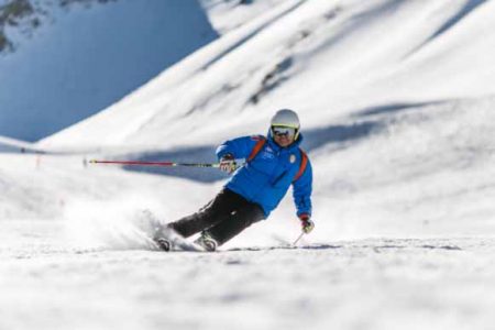 A skier in navigating a turn