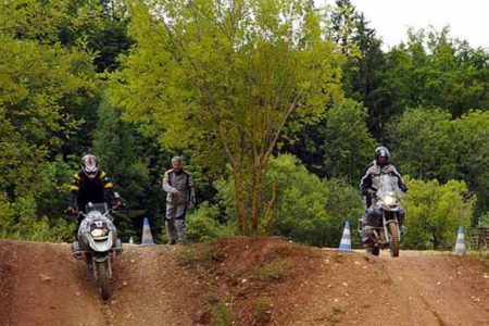 Riders in a defined motocross course